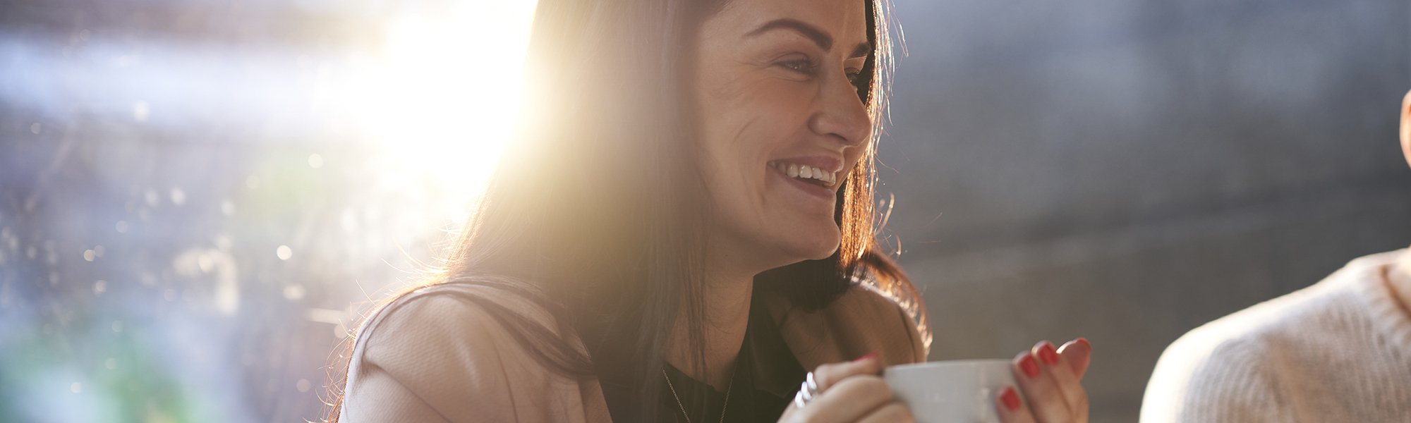 Man drinking a coffee with friends