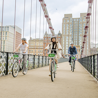 Group cycling over a bridge